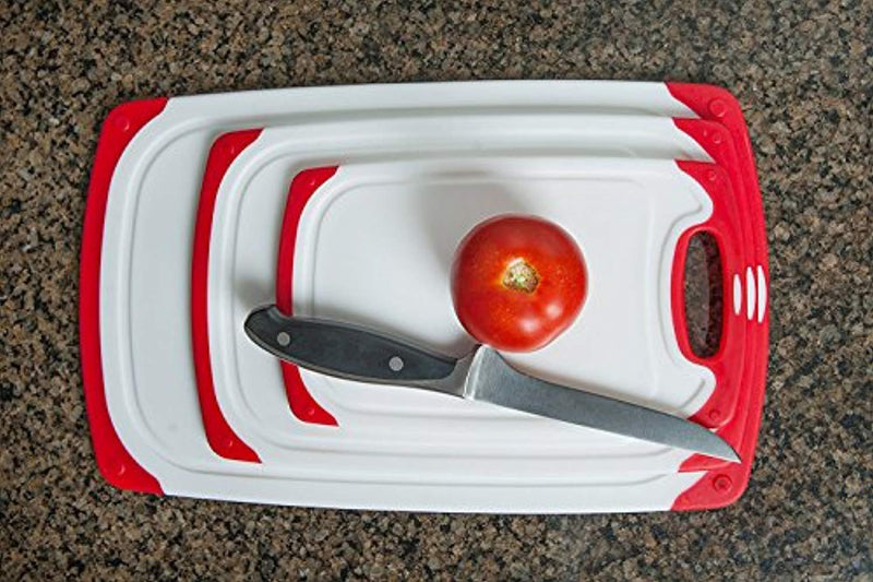 CC Boards 3-Piece Nonslip Cutting Board Set: Red and white plastic kitchen carving boards, each with juice groove and nonskid handle; dishwasher safe