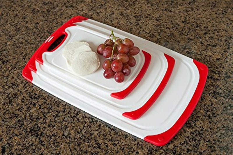 CC Boards 3-Piece Nonslip Cutting Board Set: Red and white plastic kitchen carving boards, each with juice groove and nonskid handle; dishwasher safe